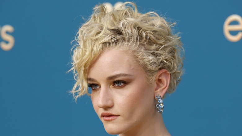 Julia Garner with short wavy blond hair