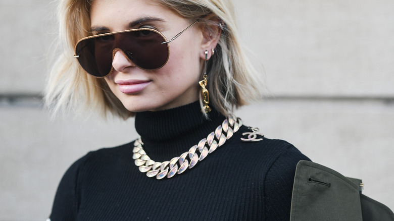 Black turtleneck with statement necklace