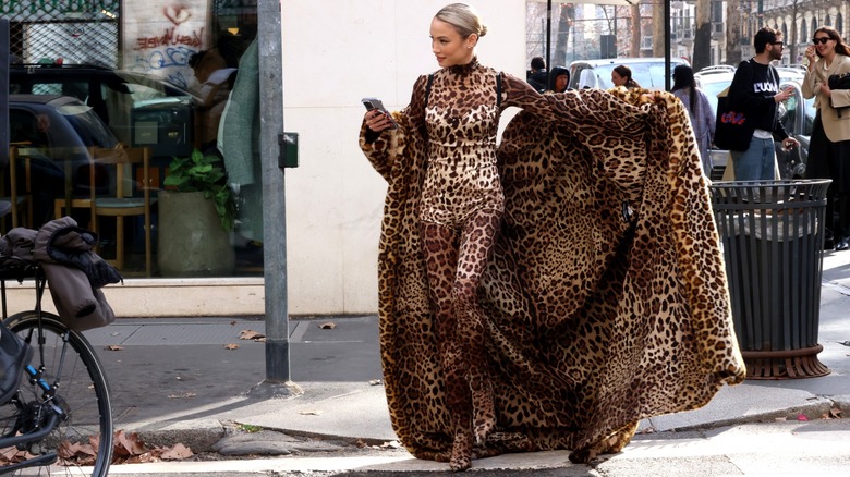 woman wearing cheetah jumpsuit