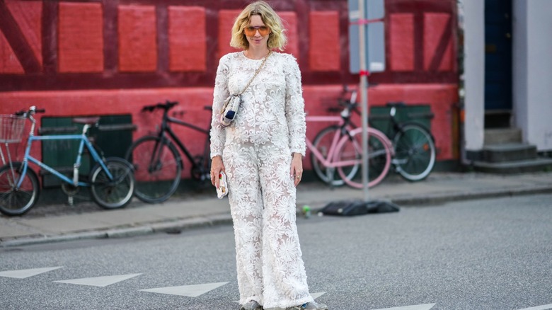 woman wearing lace jumpsuit