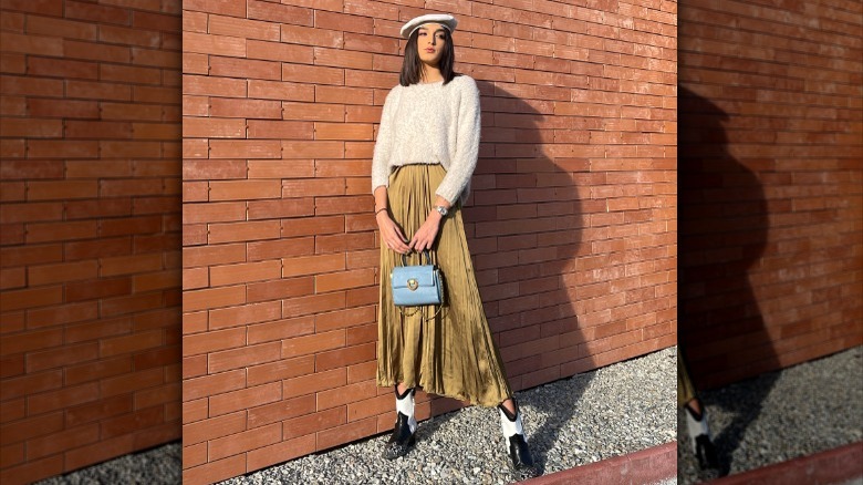 Jacqueline Barth wearing sweater and long skirt