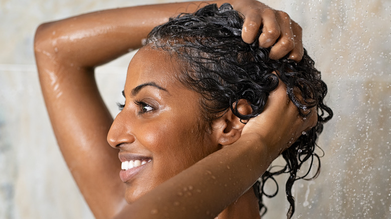 black woman shampooing her hair
