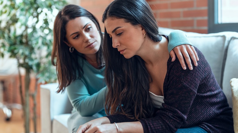 Woman comforting mother