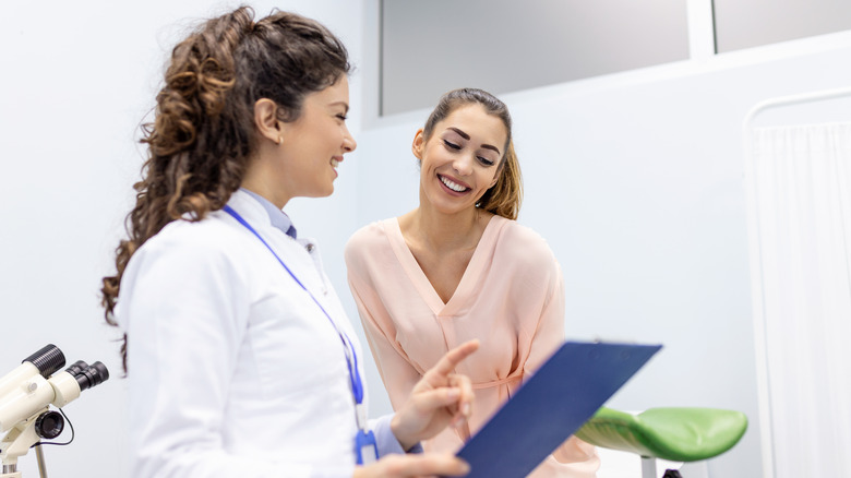 Doctor laughing with patient