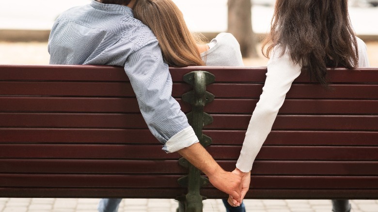 Love triangle sitting on bench