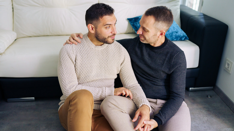 couple talking and holding hands