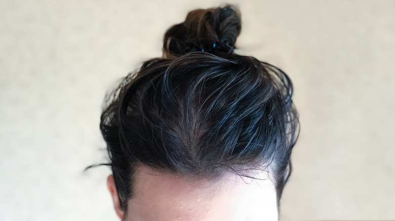 Greasy hair in bun
