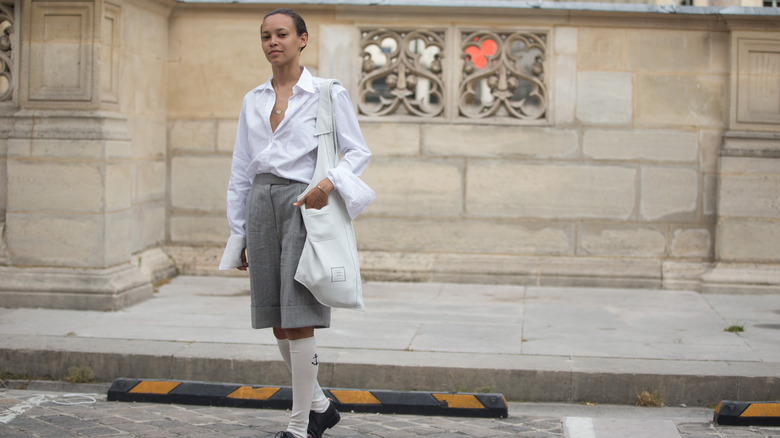 woman wearing bermuda shorts and socks