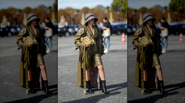 woman wearing bermuda shorts and coat
