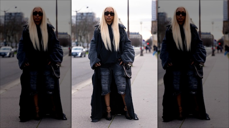 woman wearing denim bermuda shorts