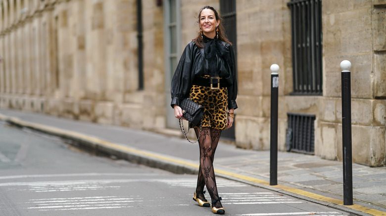 woman pairs tights with ballet flats