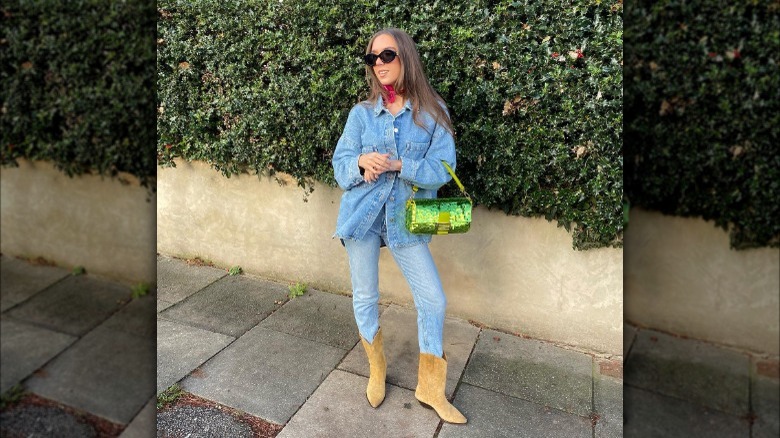 Denim on denim with cowboy boots.