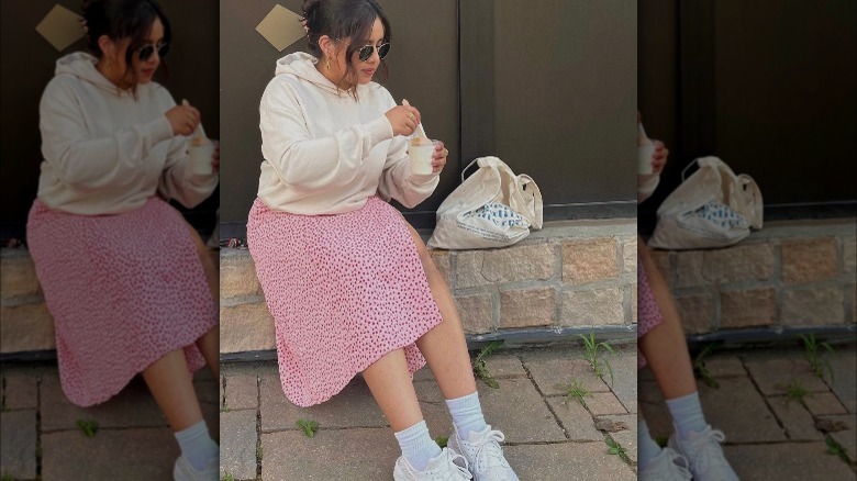 Girl with hoodie over slip dress.