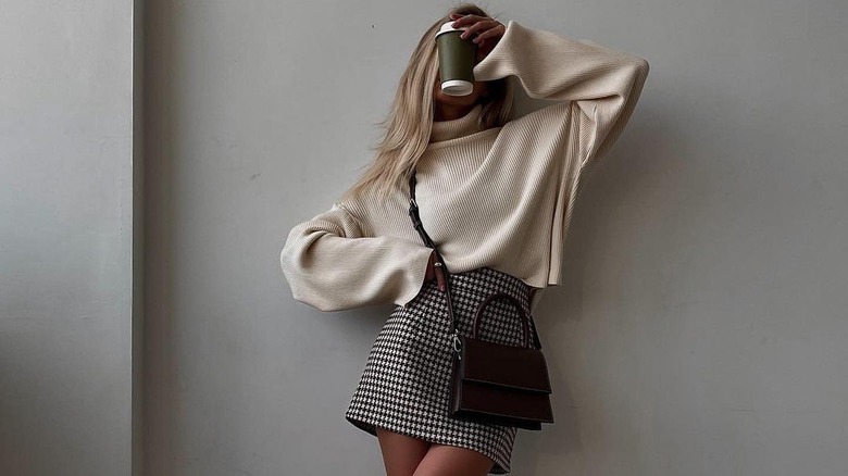 woman holding coffee cup