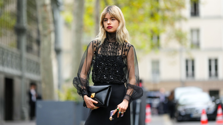 woman wearing sheer blouse