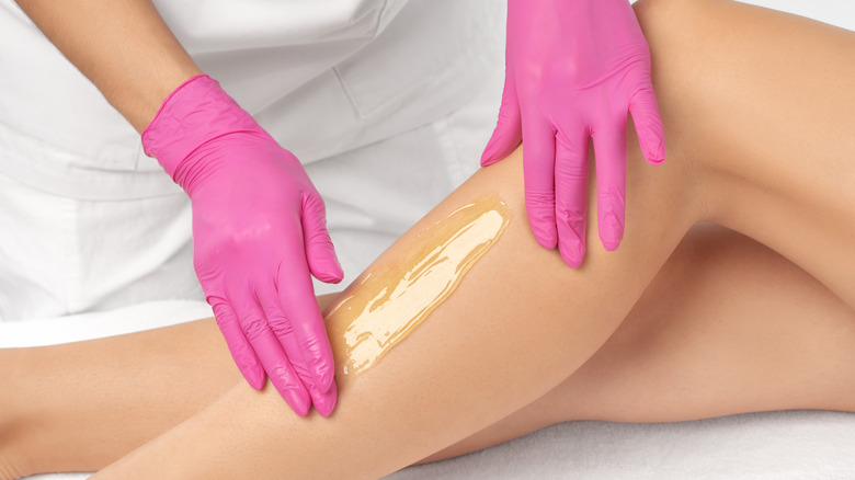 Waxing women's legs