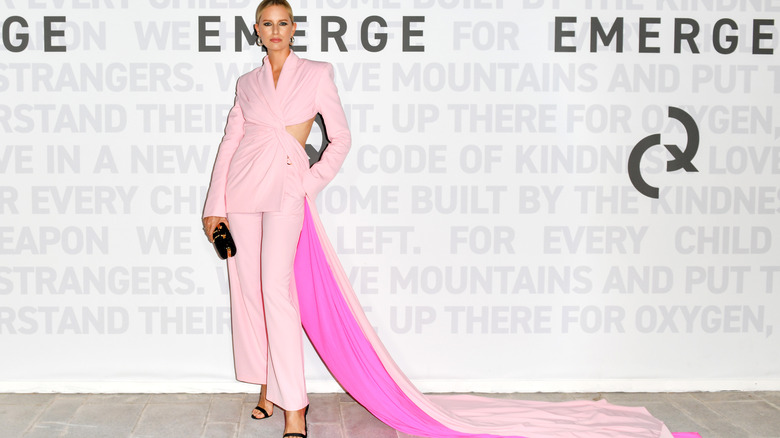 A woman in a pantsuit train