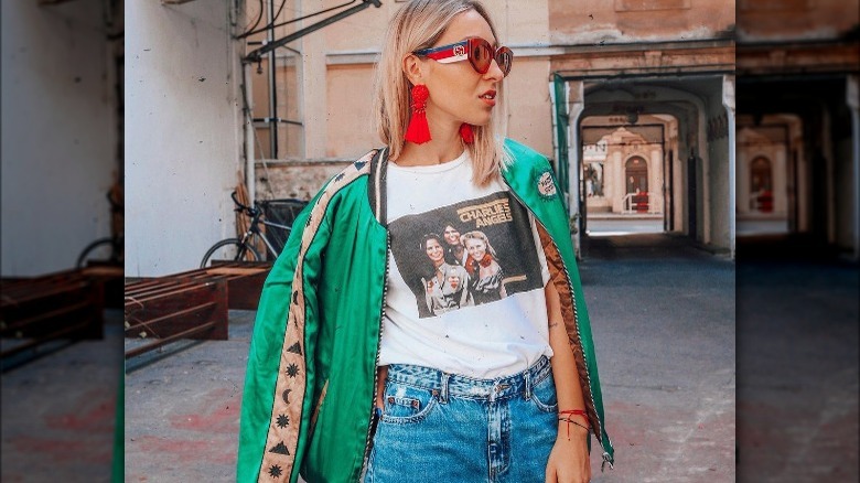 Woman wearing green bomber jacket