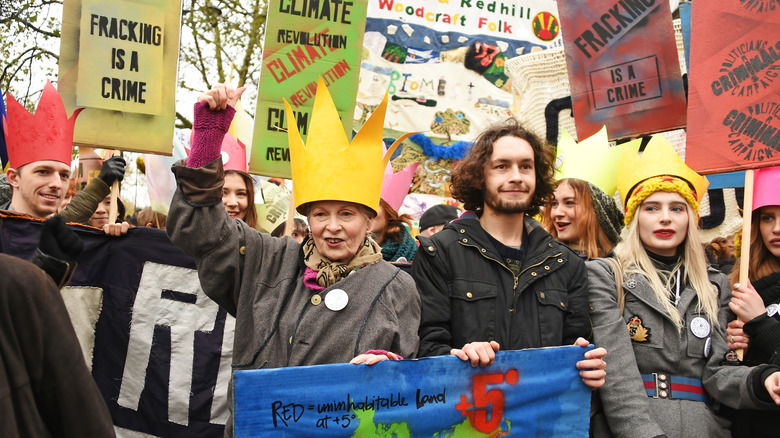 Vivienne Westwood holding sign