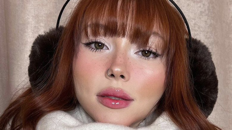 Woman wearing highlighter on eyes