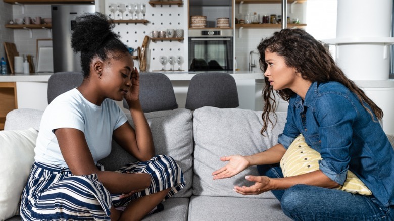 Two woman talking seriously