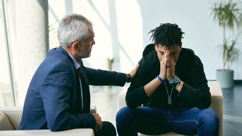 Couple comforting each other