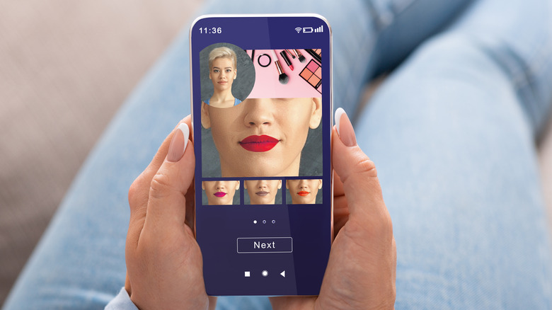 A woman using a filter on her smartphone.