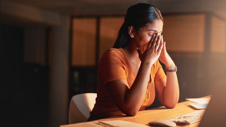Stressed woman working at office