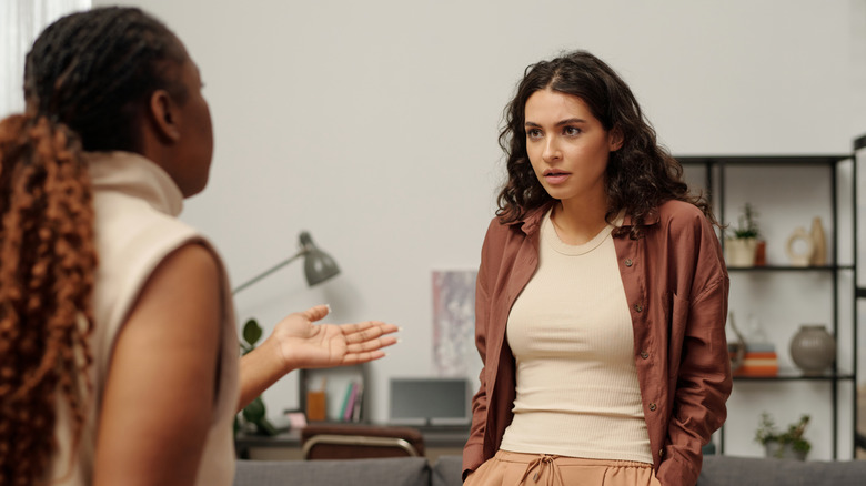 Two women speaking and communicating with body language