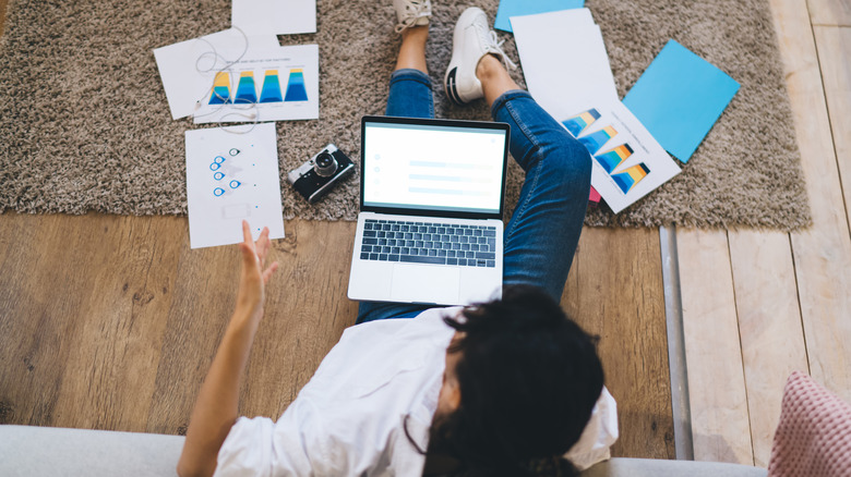 Woman with laptop on lap