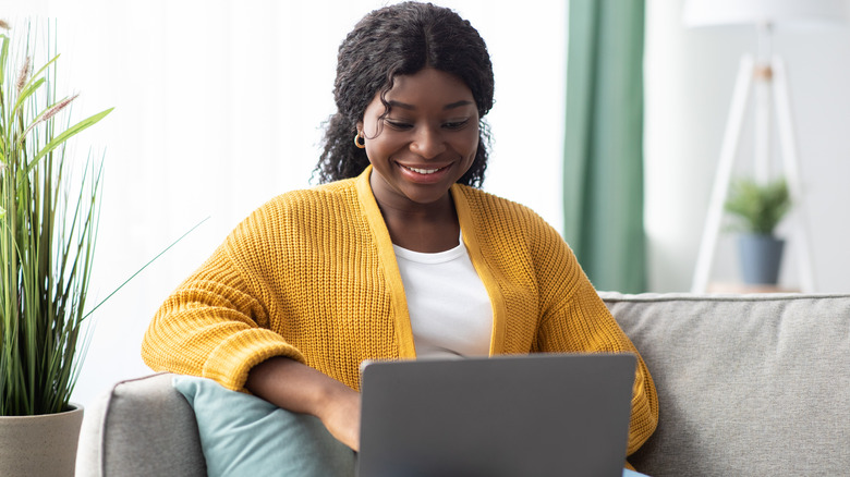 woman smiling at computer