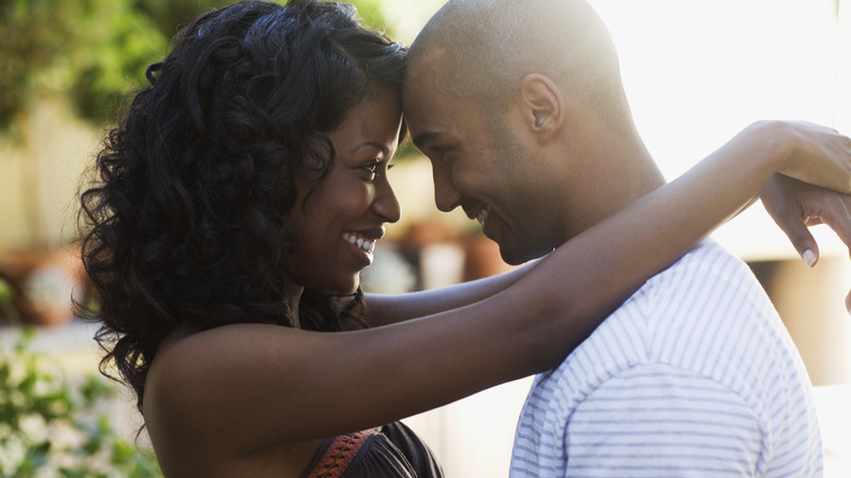 smiling couple making eye contact