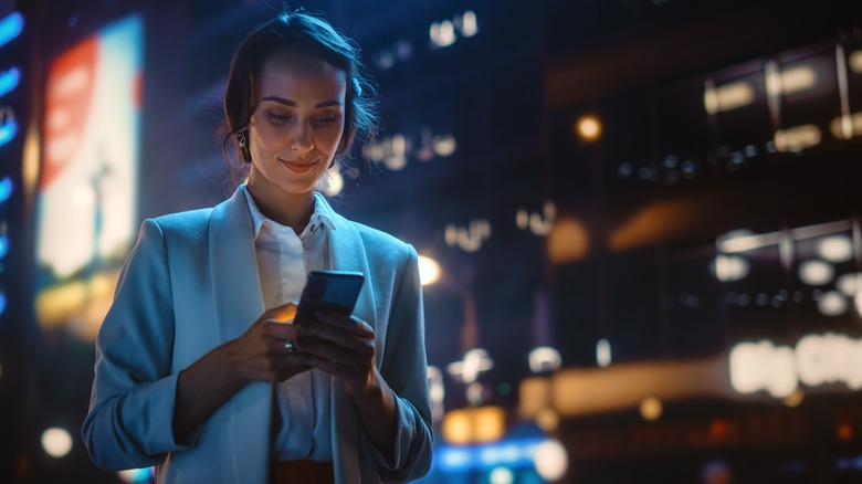 Woman smiling at her phone