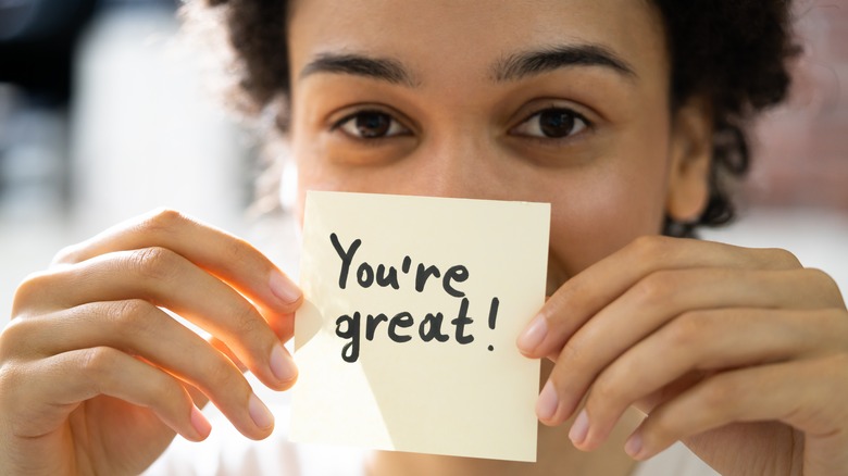 woman with a positive post-it