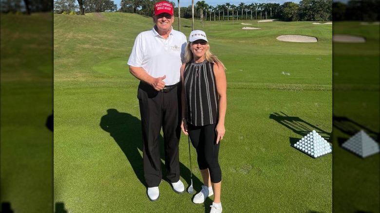 Donald Trump and Marjorie Taylor Greene on a golf course