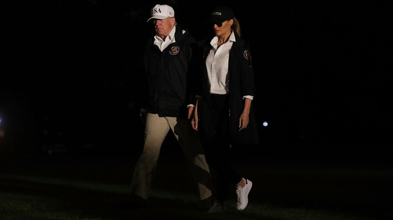 The Trumps arriving in Texas, with Melania wearing white sneakers