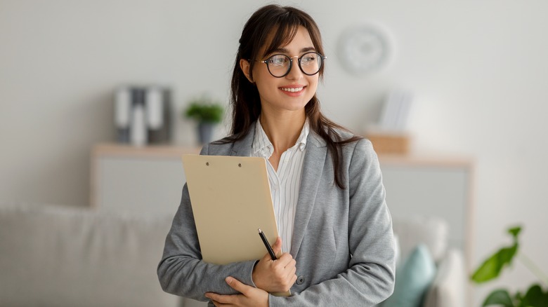 therapist holding clipboard