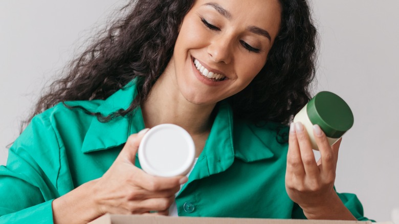 female checking product packaging