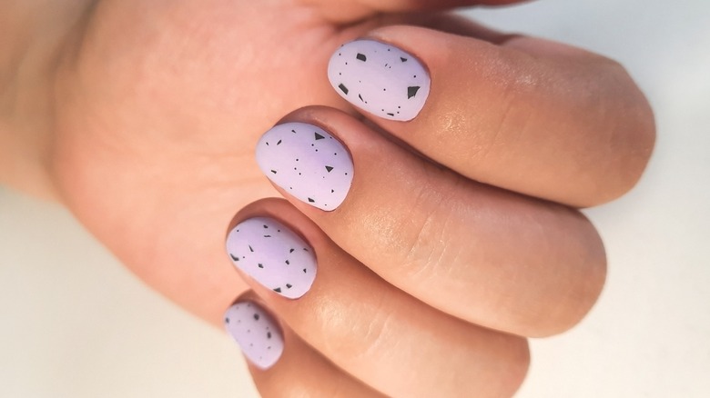 hand with lavender nails