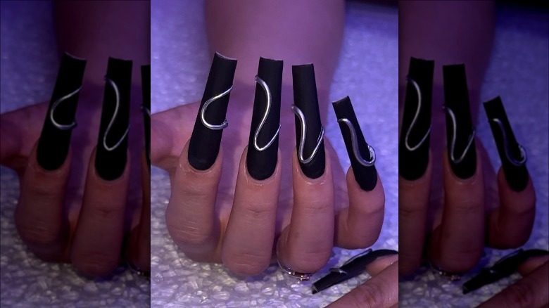 Woman with silver nail design