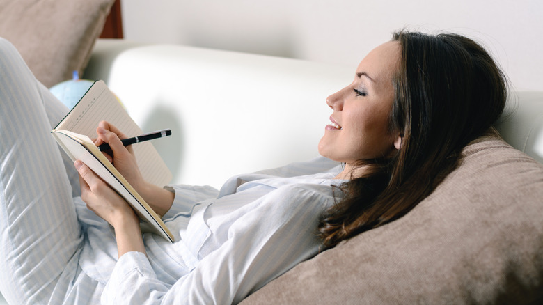Woman writing down dreams