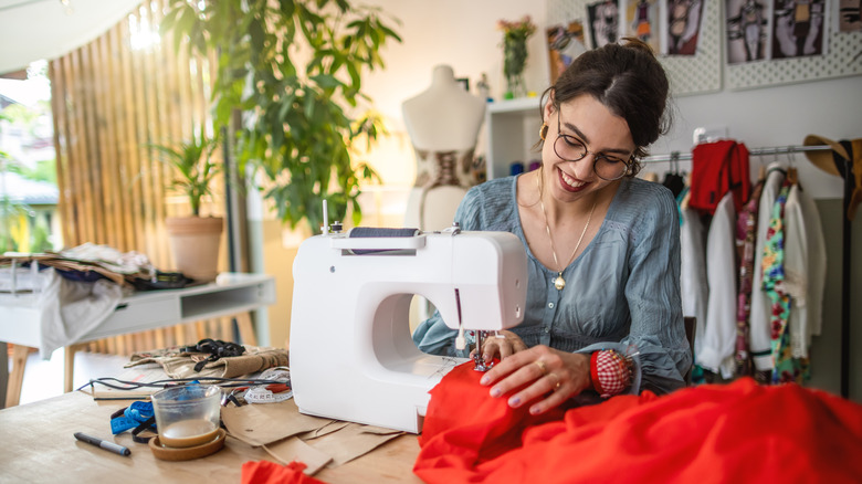 Woman using sewing machine