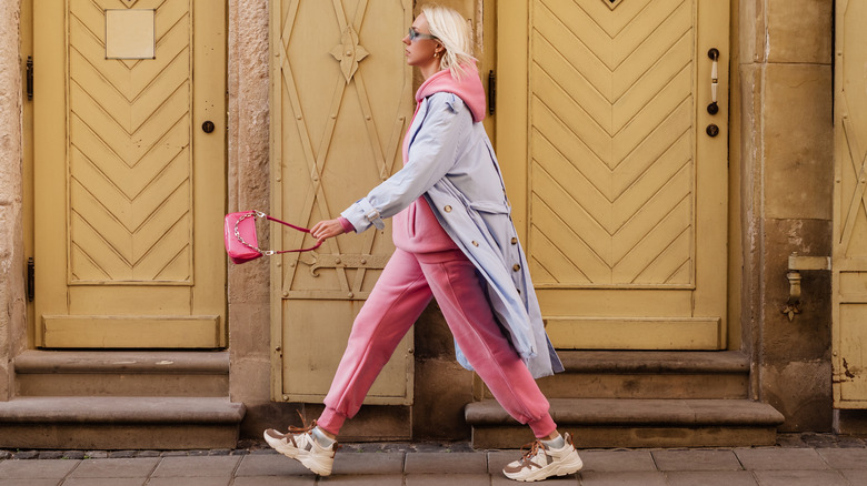 Woman walking in pink outfit