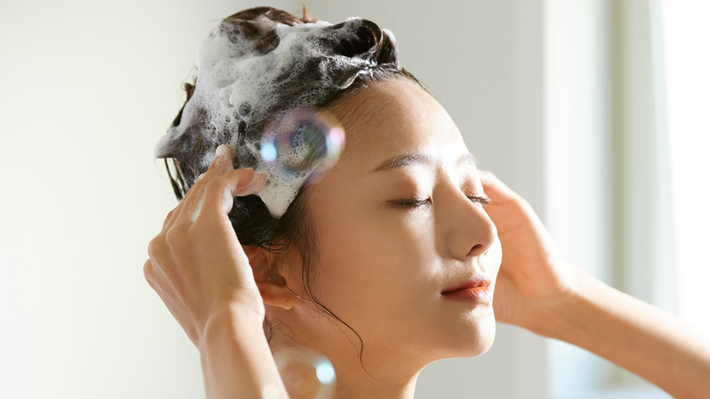 woman washing hair in shower