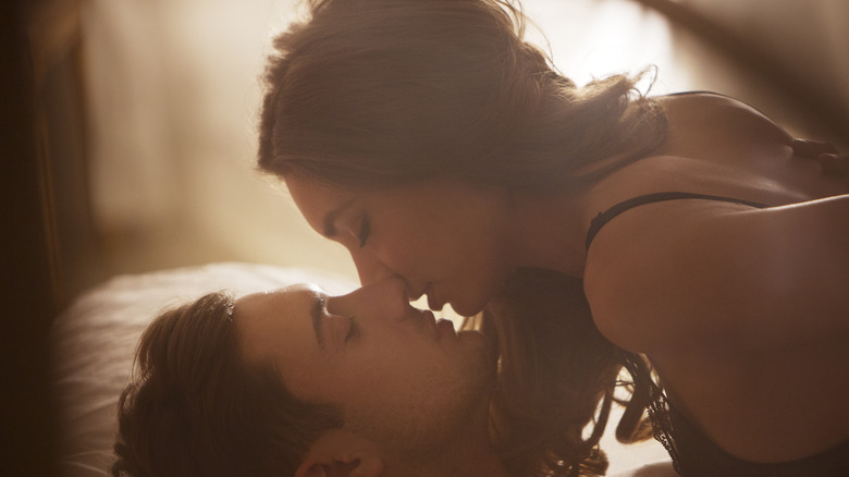 man and woman in bed