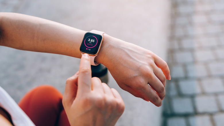 person checking their smart watch