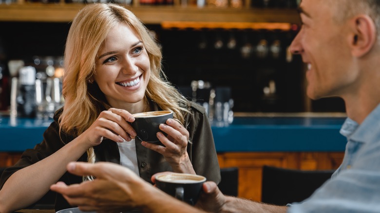 man and woman with coffee