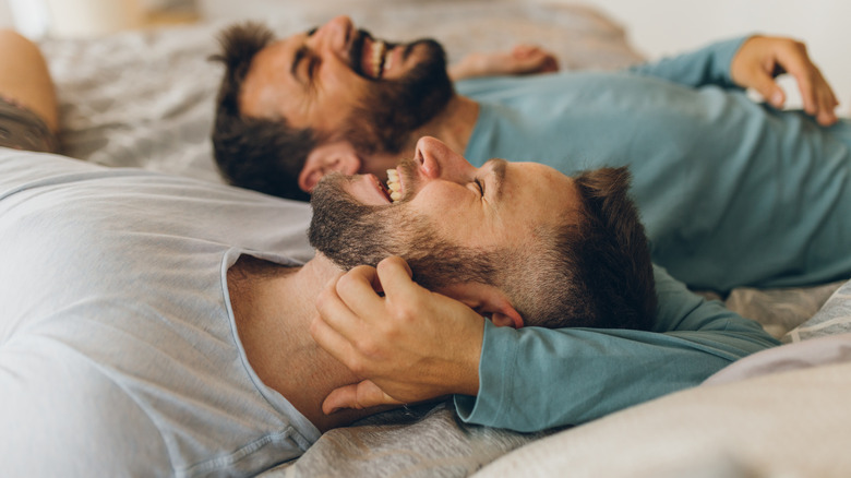 Two men in bed