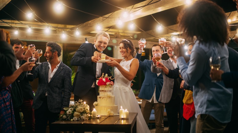 Bride and groom cutting the cake