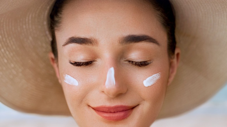 Woman wearing sunhat and sunscreen
